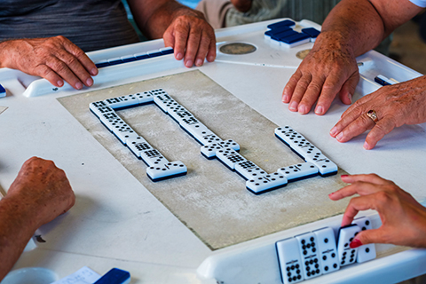 A stock photo. A zoomed in view of a game of dominos.